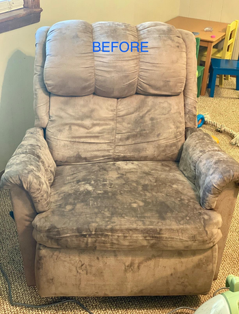 a tan suede recliner covered in dark black stains