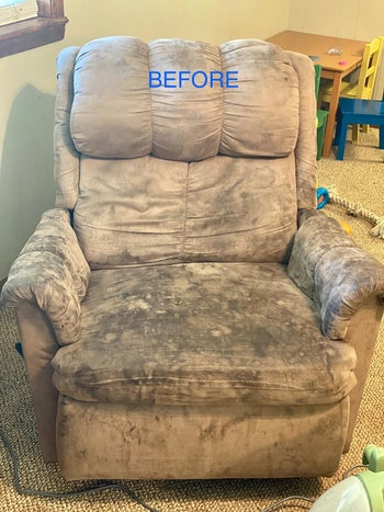 a tan suede recliner covered in dark black stains