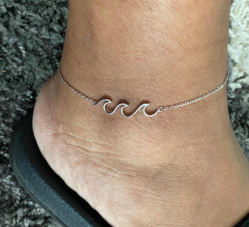 Reviewer wearing the silver ankle bracelet