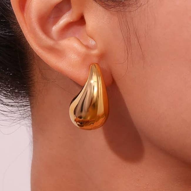 model wearing the goldtone earring