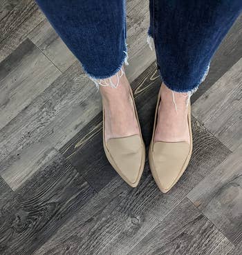 Close up of reviewer wearing the loafer in beige