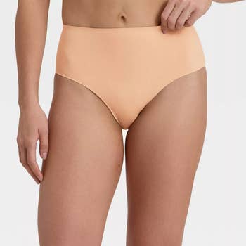 model wearing the pearl tan underwear shown from the front