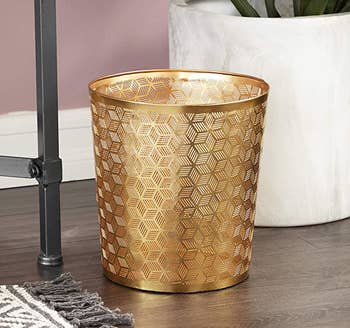 the geometric patterned gold wastebasket