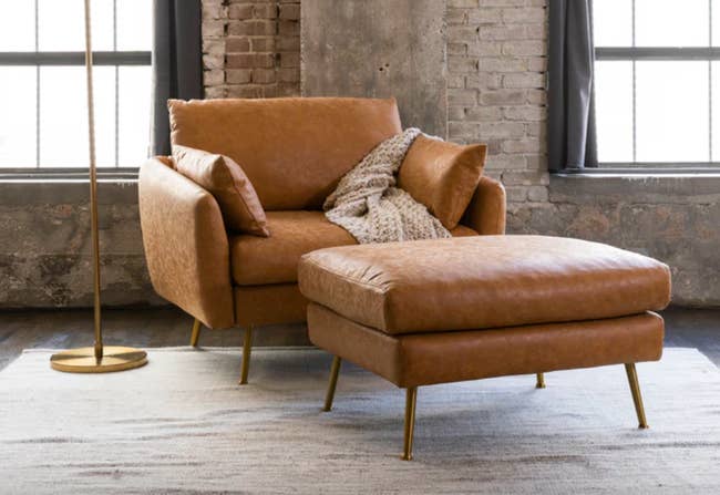 lifestyle photo of brown vegan leather couch and matching ottoman