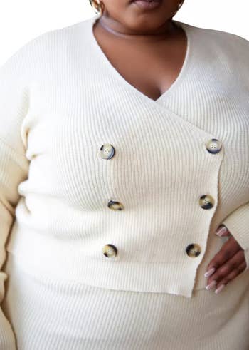 A closeup of the cardigan on the same model
