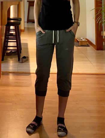 Image of reviewer wearing green capris