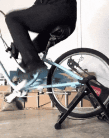 Reviewer riding their bike using the bike trainer stand