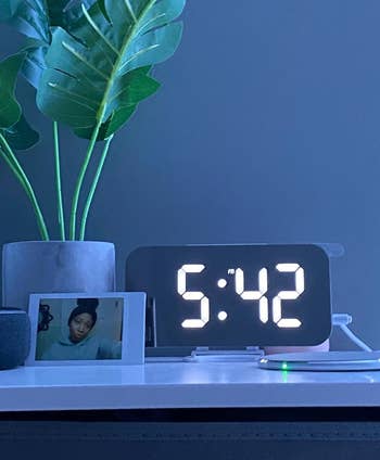 Another customer review photo showing close up of the clock on their nightstand