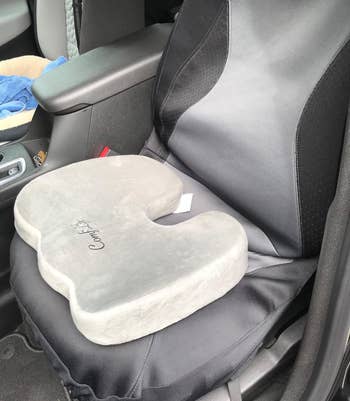 reviewer photo of the gray seat cushion on the seat of a car