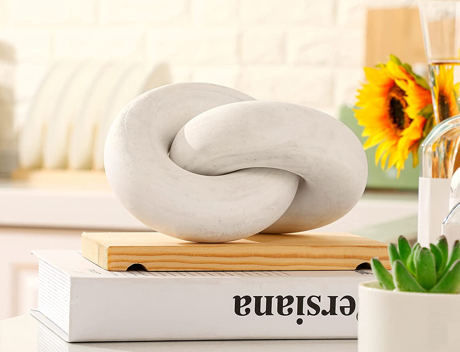 White wooden chain on top of coffee table books on white table