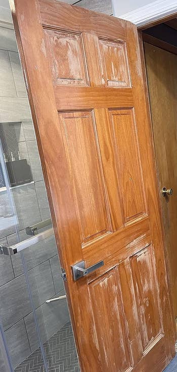 reviewer before image of a weathered wooden door with scratches