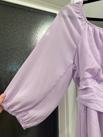 the aforesaid  purple formal  present  without wrinkles