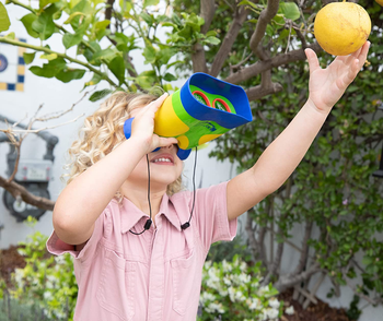 a child playing with binoculars