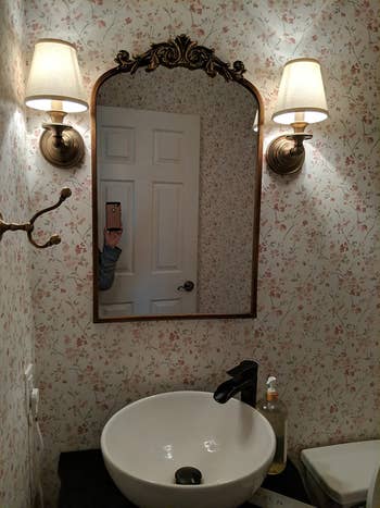 another reviewer's arched mirror above a bathroom sink