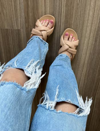 Ali wearing sandals with ripped jeans