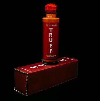 the hot sauce bottle on top of its box