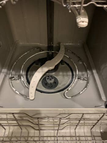 same reviewer showing their dishwasher looking brand new after using the cleaning tablets
