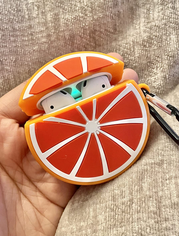 another reviewer holding the orange slice case