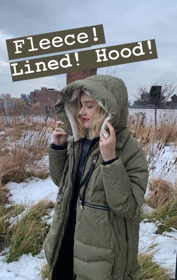 editor wearing the hood of the coat up and their text 