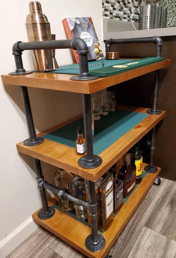 Reviewer image of the pipe bar cart with green mats