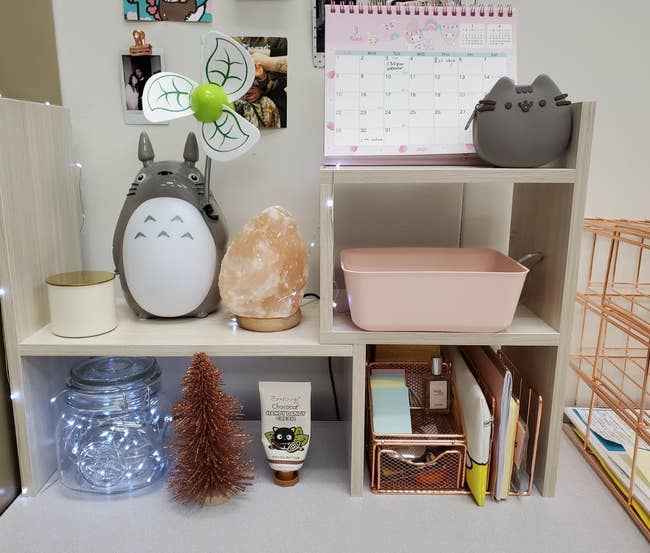Reviewer's white wood adjustable desk shelves organizing various items