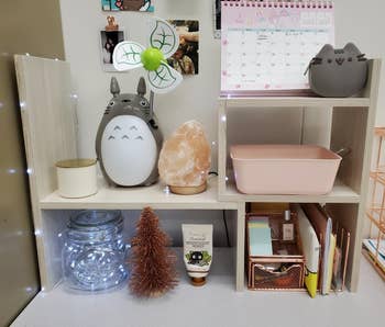 Reviewer's white wood adjustable desk shelves organizing various items