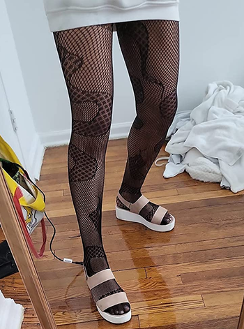 Image of reviewer wearing black snake tights
