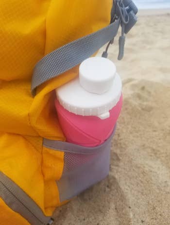 reviewer's water bottle in a backpack pocket