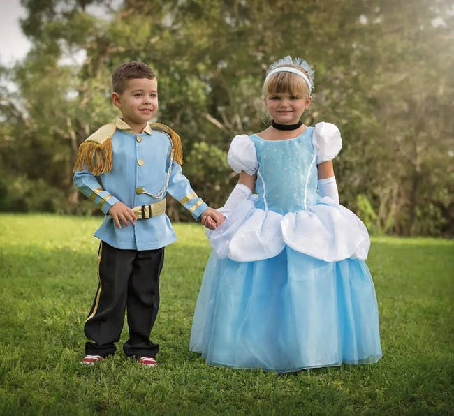 two children in prince charming and cinderella costumes