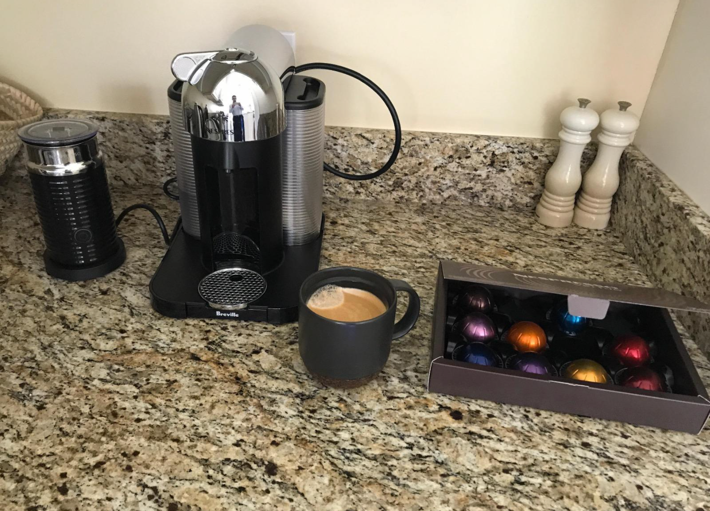 reviewer photo of the nespresso machine in their kitchen