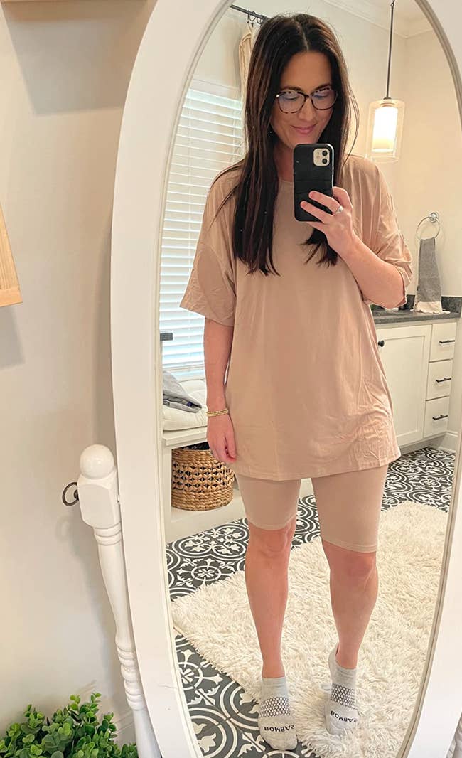 reviewer wearing nude oversized top with matching biker shorts
