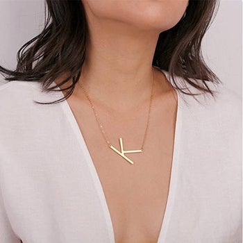 model wearing the gold k pendant necklace