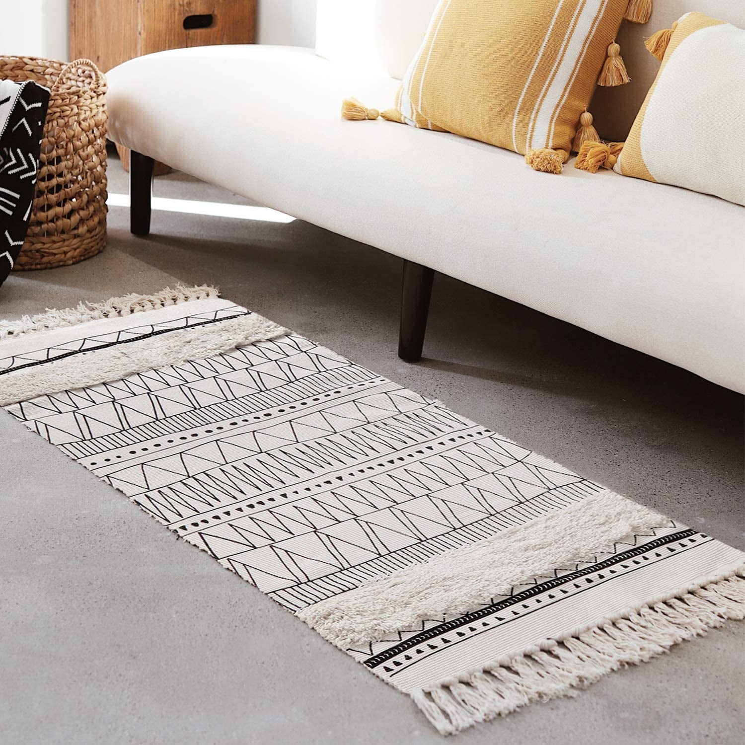 white runner with fringe and black geometric stripe pattern