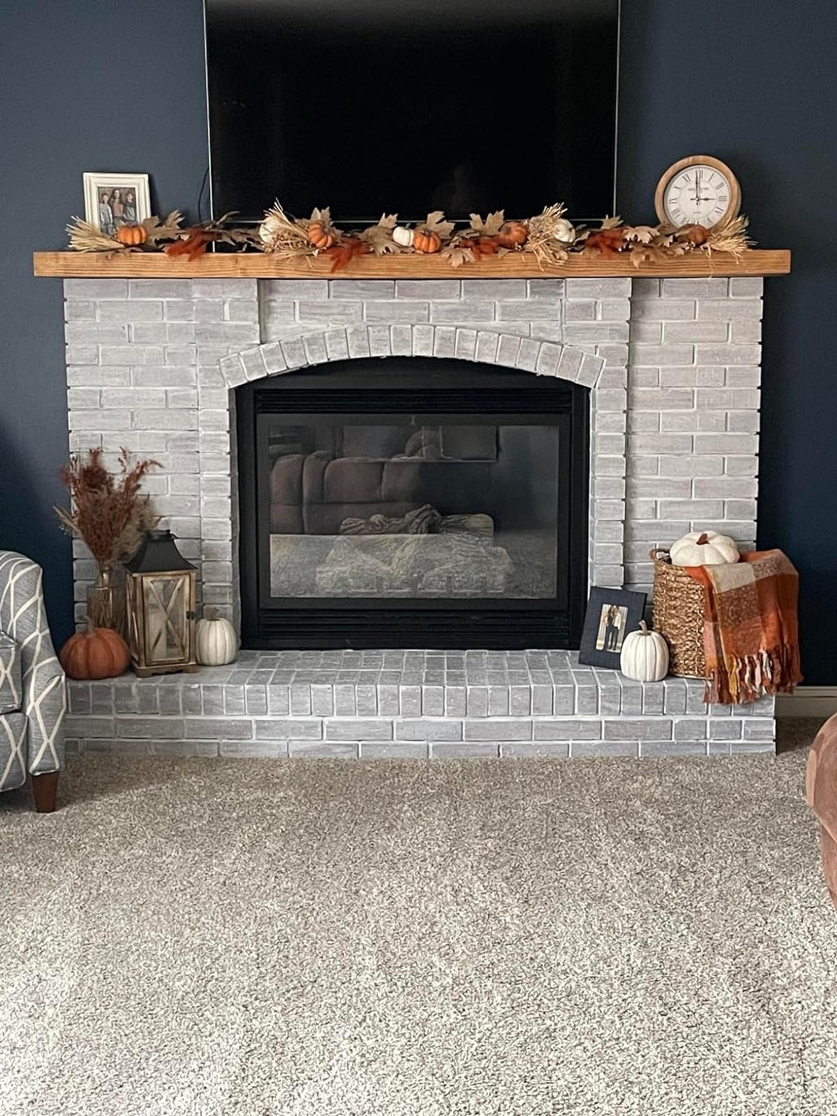 after image of the same fireplace now painted white