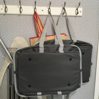 Reviewer image of the two baskets folded and hanging on the wall