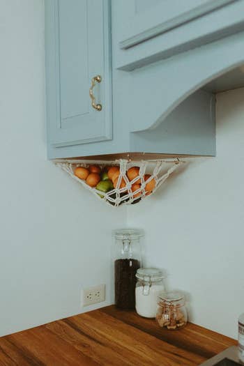 the fruit hammock under a cabinet