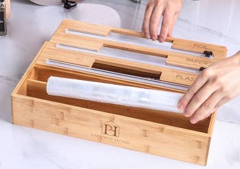 model filling the organizer with rolls