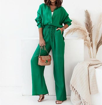 Model in a green button up shirt with a matching high waisted drawstring flared lounge pant 