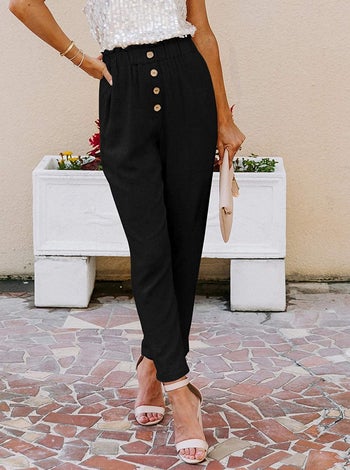 model wearing the black paperbag pants
