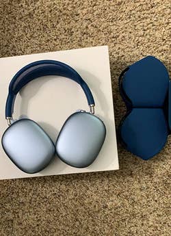 Reviewer's sky blue headphones without the case on them