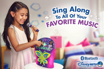 a child playing with the encanto karaoke machine