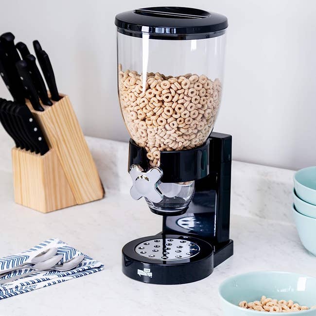 the dry cereal dispenser with cheerios inside