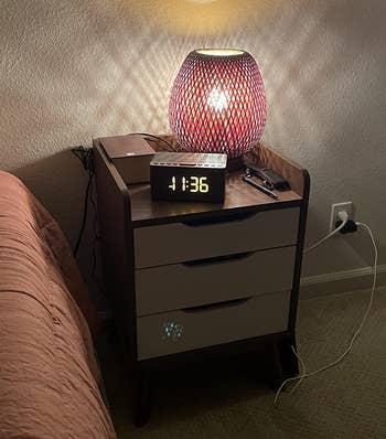 reviewer image of the rectangle clock sitting on a nightstand