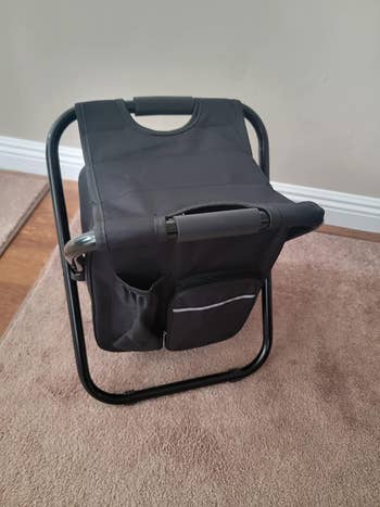reviewer's black chair set up to be sat on