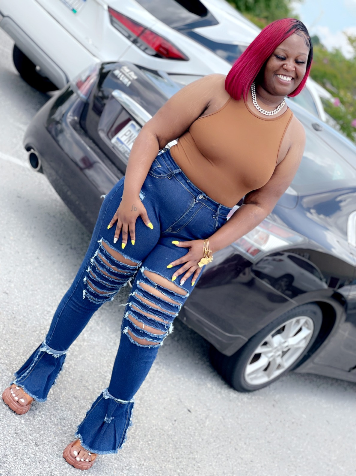 reviewer wearing the distressed blue jeans