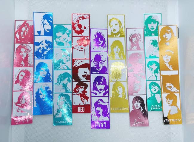 the photo strips for each album in pink, blue, teal, red, purple, yellow, rose gold, green, and gold each with several shots of taylor from the era