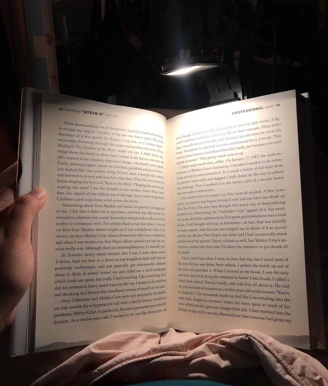 a reviewer's book illuminated by the book light
