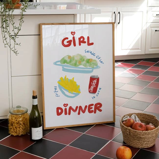 Framed poster in a kitchen showing illustrated text: