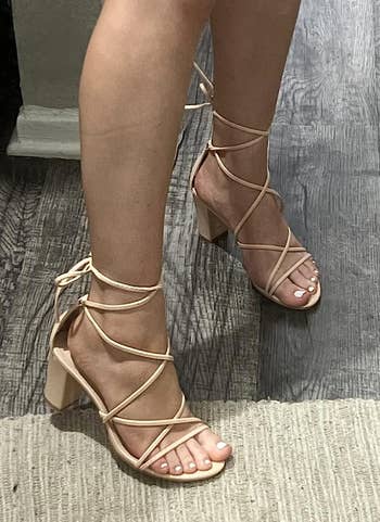 a reviewer wearing the shoes in tan 