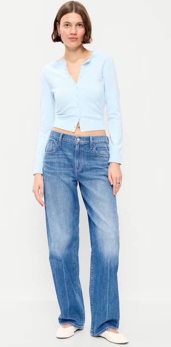 Person successful  casual buttoned cardigan and jeans, lasting  confidently. Ideal for benignant   inspiration successful  a buying  context